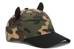 Detail view of camouflage baseball cap with black 3D decorative horns and curved brim
