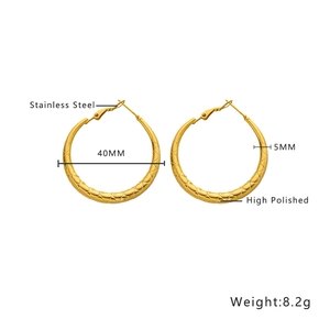 Detail of 40mm gold-plated stainless steel hoop earrings with quilted texture design