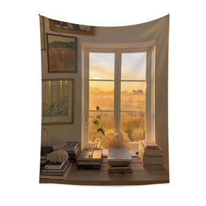 Detail of bohemian tapestry featuring a warm sunset window scene and artistic home decor