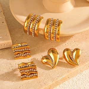Three pairs of gold stainless steel geometric hoop earrings with sparkling crystal accents