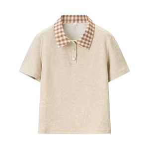Detail of beige knit Polo top featuring a brown plaid collar and white decorative buttons