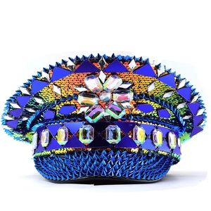 Klein blue punk captain hat with sequins, metallic studs, and rhinestone flower ornament