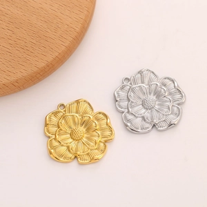 Detailed view of sunflower jewelry pendants in gold and silver finish for DIY crafting