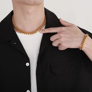 Men's 10mm gold-plated Cuban link necklace and bracelet set shown on model