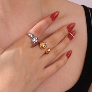 Polished gold and silver drip-shaped stainless steel open rings for women on hand