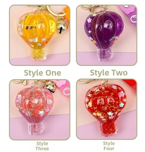 Detailed grid view of glitter-filled hot air balloon keychains in four vibrant colors