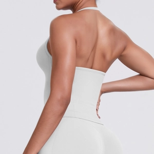 Macro detail of breathable light gray ribbed fabric on halter neck yoga sports bra
