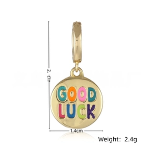 Detail showing 2.9cm Good Luck gold pendant with colorful enamel lettering and dimensions
