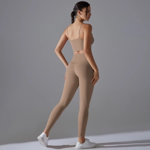 Detail view of khaki high-waisted yoga leggings and sports bra with a racerback design
