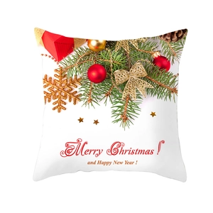 Detailed view of white Christmas pillow cover with festive pine branch and ornaments