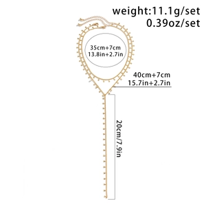 Detailed view of layered gold necklace with teardrop charms and long tassel measurements