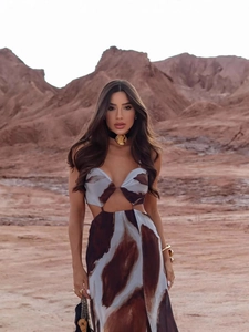 Sleeveless tie-dye cutout maxi dress with abstract print and flowing silhouette