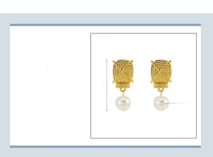 Detailed close-up of 18K gold plated steel earrings with woven texture and white pearl pendant