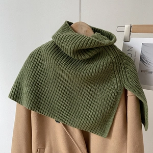 Detailed knit texture of olive green turtleneck neck warmer on a wool coat
