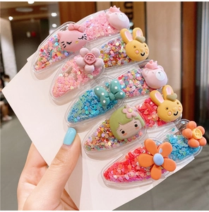 Close-up of 8pcs glitter-filled plastic hair clips with cute 3D cartoon characters