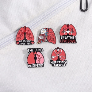 Five unique lung-themed enamel pins with floral designs and medical respiratory therapist slogans