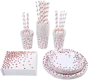 Macro shot of white party tableware set featuring rose gold polka dots detail