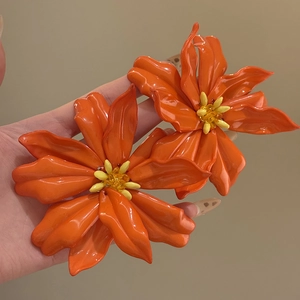 Glossy orange acrylic flower earrings with yellow stamen on silver needles for women