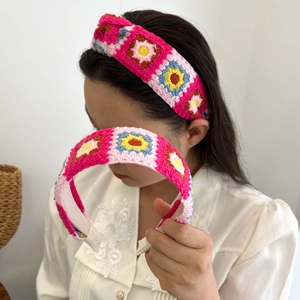 Handmade crochet floral headband with colorful granny square knit pattern for women