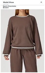 Detail show of deep chocolate brown crewneck sweatshirt with white stripe ribbing details