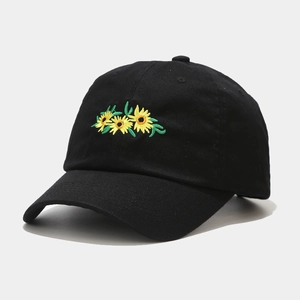 Close-up of a black cotton baseball cap with yellow sunflower embroidery on front