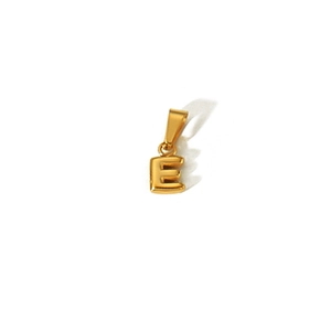 Detail of 18k gold plated stainless steel letter E pendant with a polished finish