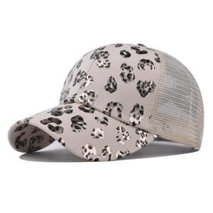 Detail of leopard print baseball cap with metallic gold foil texture and mesh back
