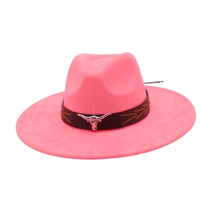 Detail of hot pink felt cowboy hat with silver bull head emblem and black leather band