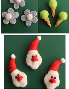 Detail of handmade wool felt Christmas ornaments including Santa Claus and floral designs