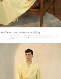 Detail of yellow waffle weave bathrobe featuring soft combed yarn fabric and breathable texture