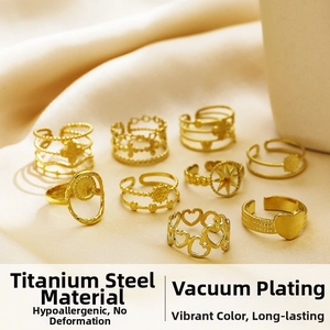 Collection of 18k gold plated stainless steel rings with heart and star motifs on silk