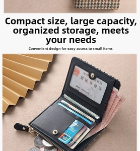Macro view of compact black leather wallet showing multiple card slots and zipper pocket