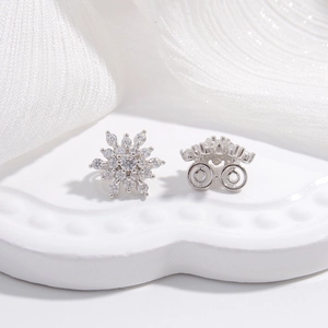 Elegant S925 sterling silver snowflake earrings with sparkling zircon on a white stand