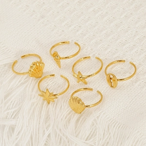 Adjustable gold ocean rings set featuring starfish and seashell designs for women