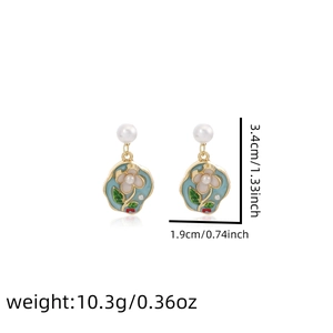 Detail view of floral enamel earrings with pearls, measuring 3.4cm by 1.9cm in height