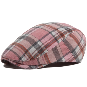 Pink and grey herringbone plaid flat cap with a classic vintage British peak design