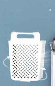 Close-up detail of white hollow plastic laundry basket with breathable lattice design.