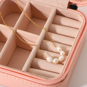 18K gold-plated stainless steel necklace featuring five natural freshwater pearls on a pink box
