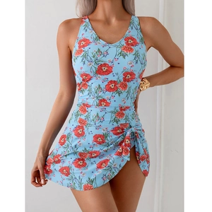 Detail view of floral print beach dress with waist knot and irregular split hem detail