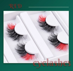 Detailed macro view of dense red and black gradient faux mink eyelashes in two pairs