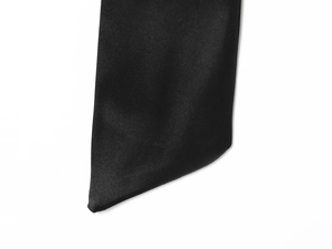 Detail view of premium black satin fabric texture with elegant silky luster and bias cut
