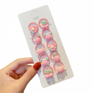 Set of 10 pink elastic hair ties for girls with cute cartoon cherry and pineapple charms