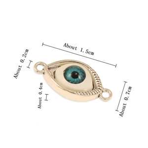 Golden Evil Eye pendant connector made of resin and alloy with blue eye motif