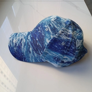 Blue and white wave pattern baseball cap with six-panel structure and curved brim design