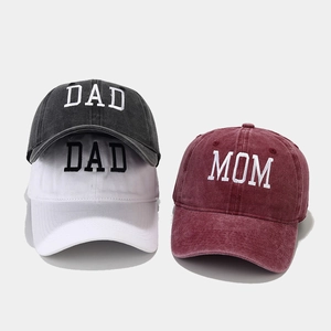 Detail view of washed cotton baseball caps with high-quality DAD and MOM embroidery
