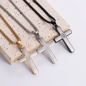 Three stainless steel cross necklaces in gold, silver, and black with inlaid zircons