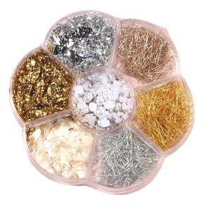 Petal-shaped box with nail art foils, metallic wires, pearls and shell fragments
