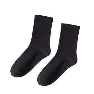 Classic mid-calf black cotton socks for women on a white background with fine knitting