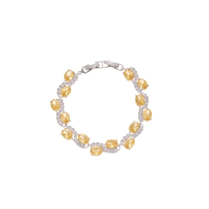Sparkling silver bracelet with oval yellow gemstones and zircon stones in a wavy design