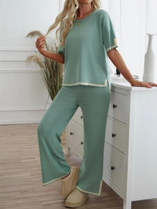 Detail of mint green knit loungewear set with elegant beige contrast trim finish